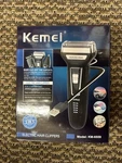 Kemei KM-6559 Rechargeable Cordless Hair Clipper, 3 Foil Heads, Black. Fixed Price $17.80.