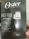 Oster Professional Fast Feed Cordless Clipper And Trimmer Black/ Silver Set. Fixed Price $240.00.