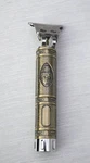 Kemei KM-1974A Cordless Hair Clipper Buddha Gold Silver Tone. Fixed Price $9.99.