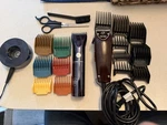 Oster Professional Fast Feed Clipper & Beard Club Wireless Trimmer With Combs. Fixed Price $150.00.