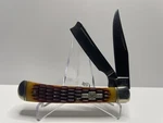 Rough Ryder Amber Jigged Bone Razor Trapper 4 1/8" Pocket Knife RR072. Fixed Price $19.99.