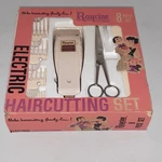 Raycine Electric Haircutting Kit 8 Piece Beige, Scissors, Combs, Storage Case. Fixed Price $10.00.